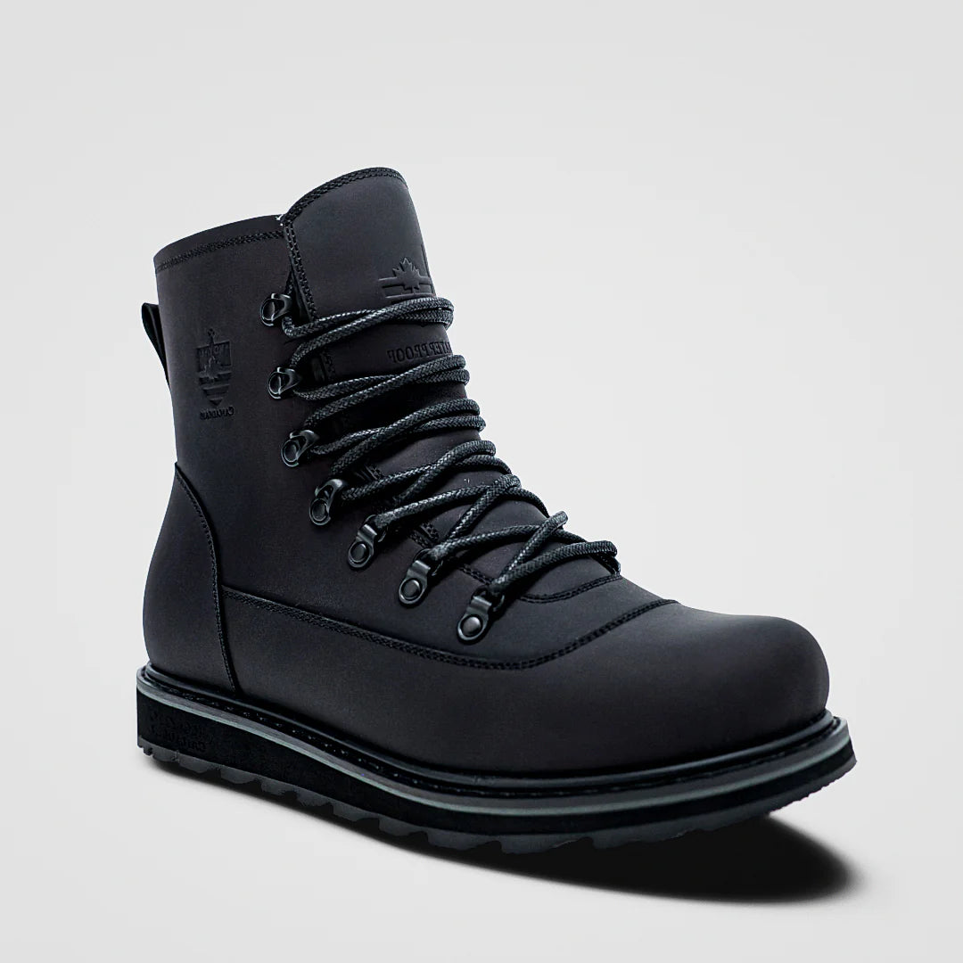 Black boot with laces on a light gray background