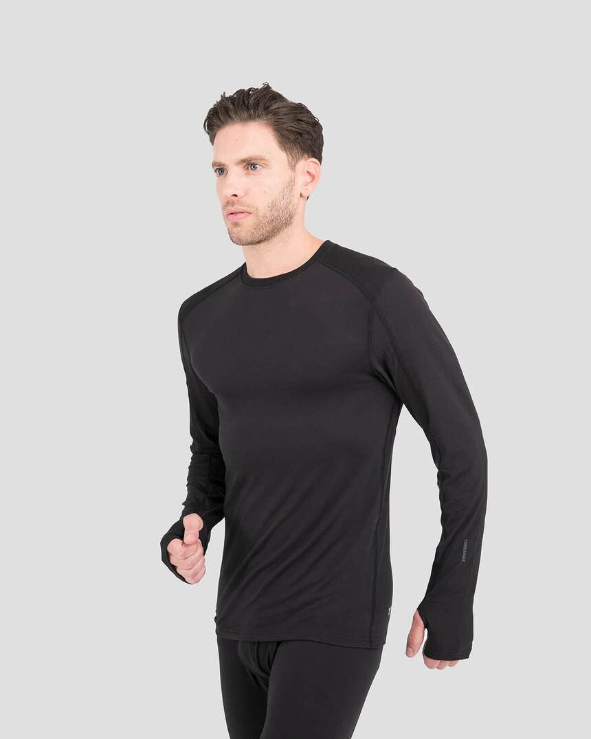 Man wearing a black long-sleeve athletic shirt on a light gray background