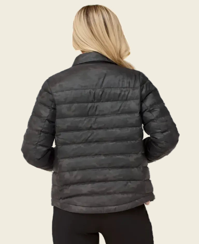 Person wearing a black puffer jacket on a white background
