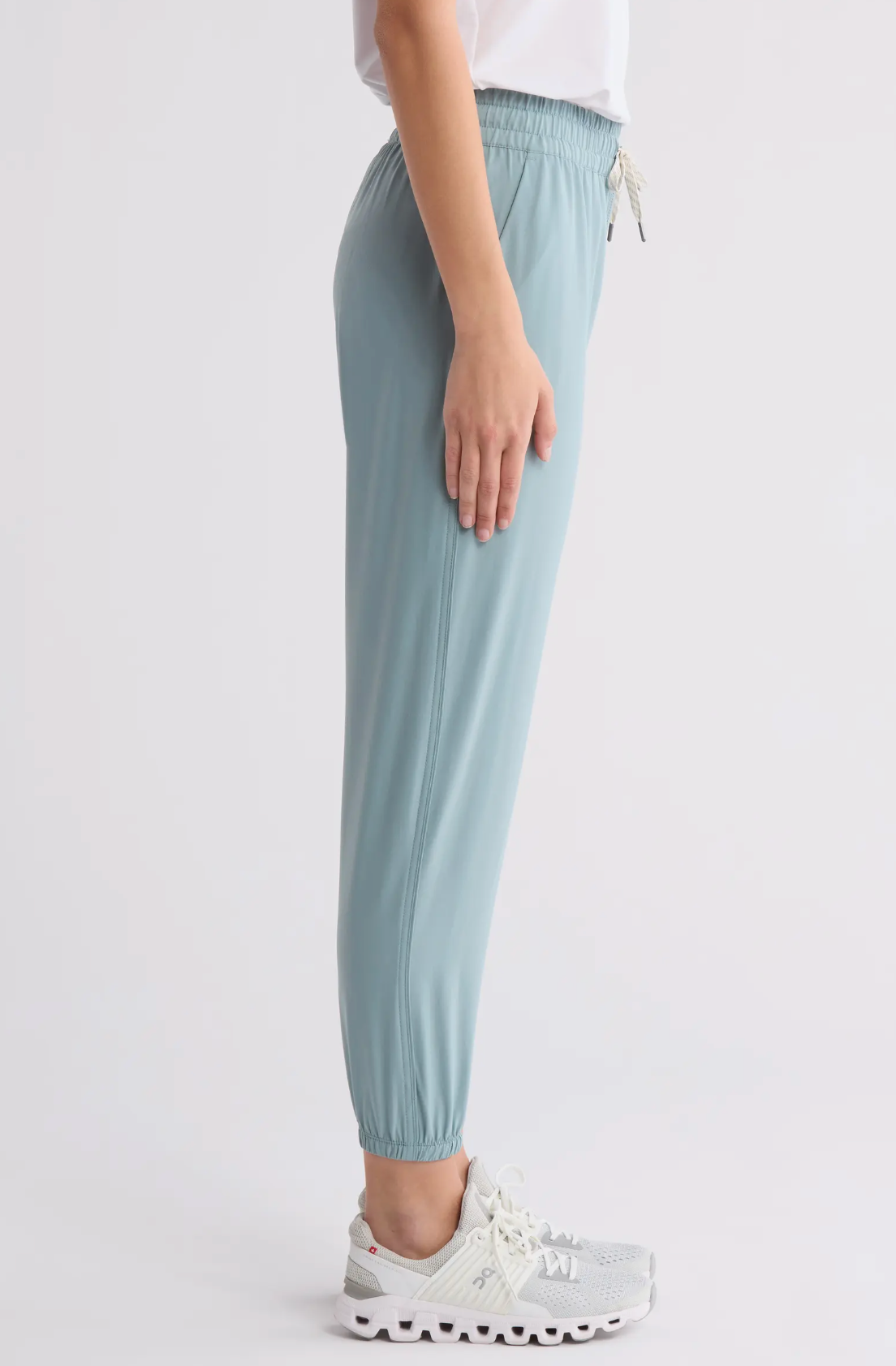 Light blue pants worn by a person on a white background