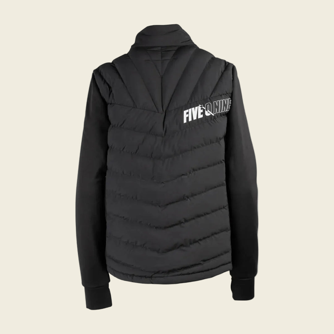 Black puffer vest with 'FIVE O'Nine' branding on a white background